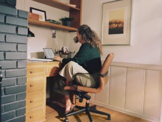 Woman working at desk with coffee